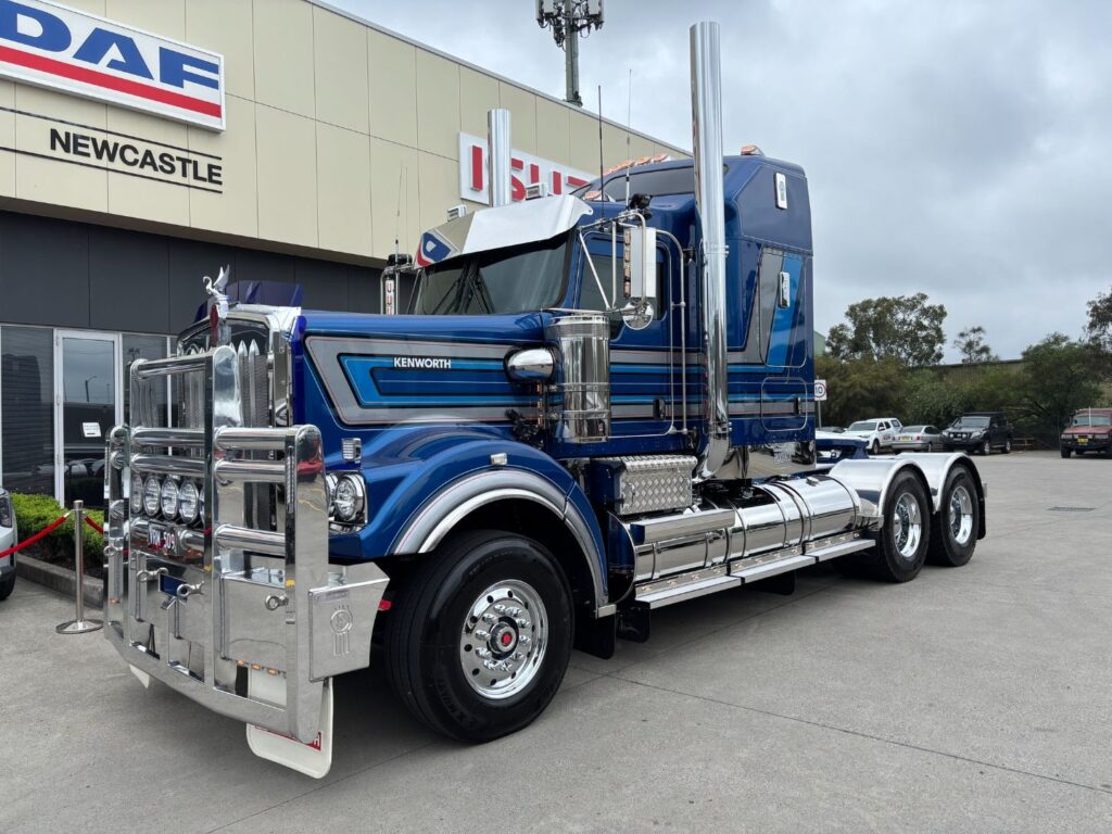 Kenworth C509 parked at dealership with Compas Transport build
