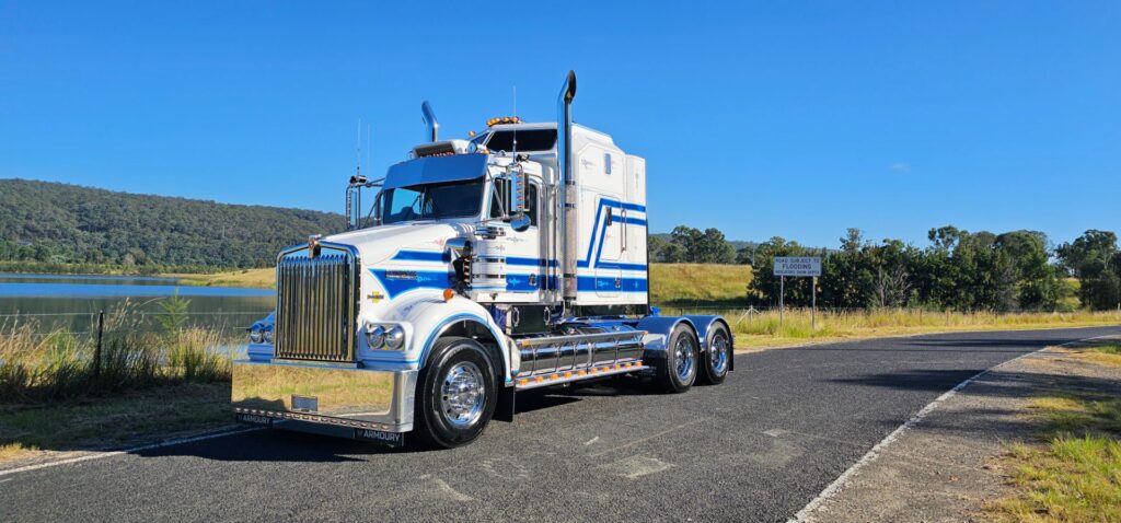 White and blue Kenworth Legend SAR truck under blue sky
